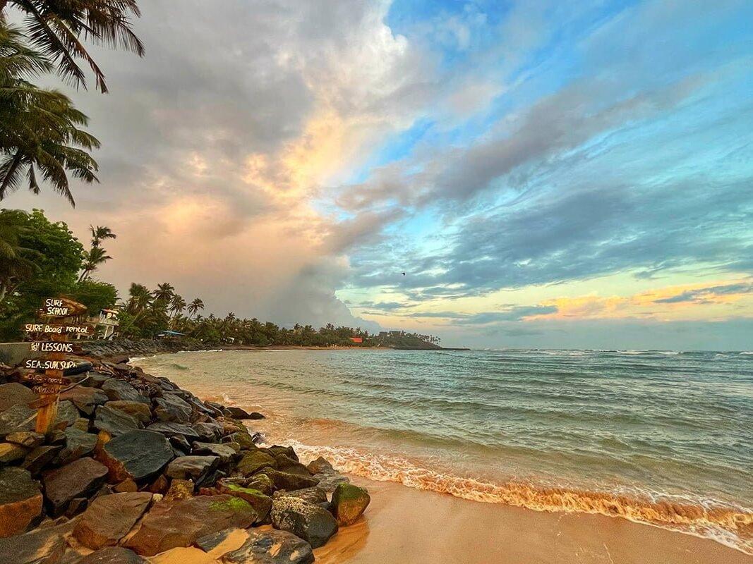 The golden shoreline and evening sky at Mirissa Beach